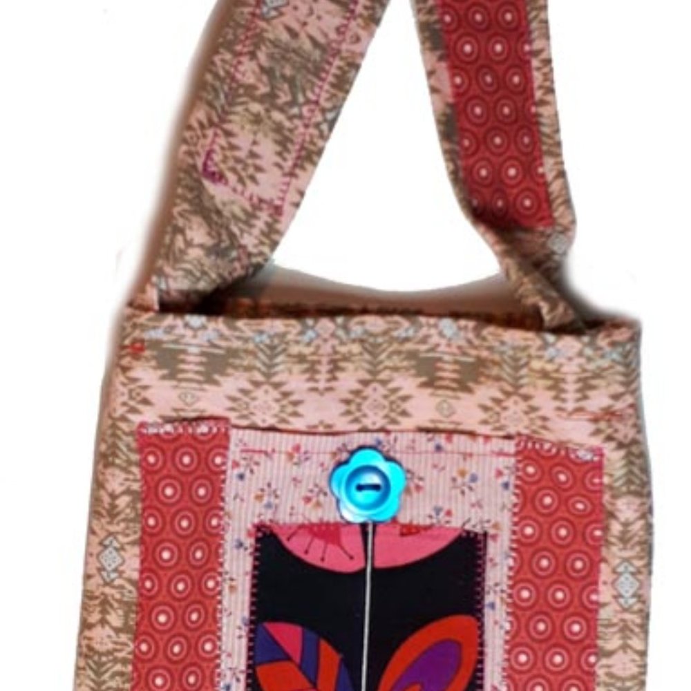 Handcrafted everlasting gift bag. Flower applique with blue button. Front pocket